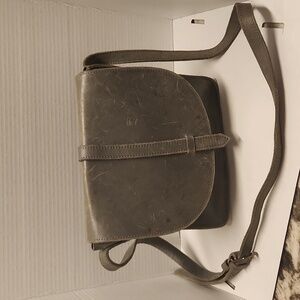 Fashionable leather purse grayish crossbody has scratches